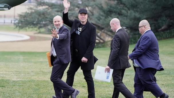 FILE - From left, Commerce Secretary Howard Lutnick, Elon Musk, Stephen Miller and Steven Cheung walk to board Marine One with President Donald Trump on the South Lawn of the White House, March 14, 2025, in Washington. (AP Photo/Alex Brandon, File)