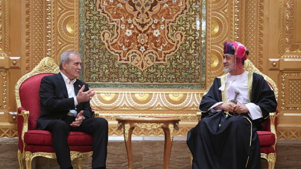 In this photo released by the Iranian Presidency Office, President Masoud Pezeshkian, left, speaks with Oman's Sultan Haitham bin Tariq Al Said during their meeting in Muscat, Oman, Tuesday, May 27, 2025. (Iranian Presidency Office via AP)