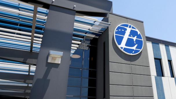FILE - An exterior look of the Express Scripts mail-in pharmacy warehouse, Tuesday, July 10, 2018, in Florence, N.J. (AP Photo/Julio Cortez,File)