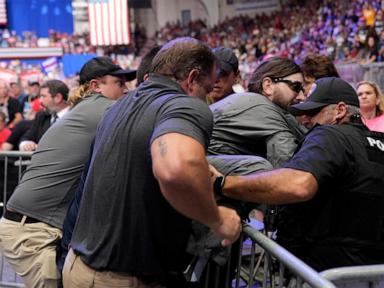 Police say a man will face charges after storming into the press area at a Trump rally