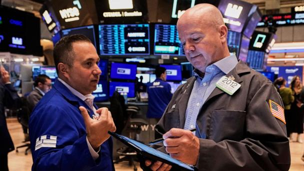 Specialist Gennaro Saporito, left, and trader Patrick Casey work on the floor of the New York Stock Exchange, Thursday, May 29, 2025. (AP Photo/Richard Drew)
