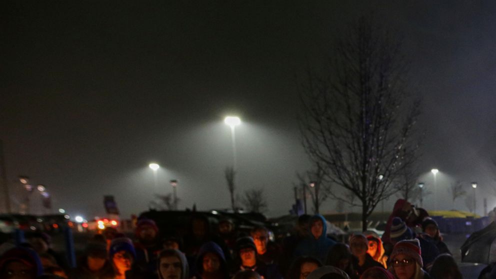 FILE - Buffalo Bills fans and community members gather for a candlelight vigil for Buffalo Bills safety Damar Hamlin on Tuesday, Jan. 3, 2023, in Orchard Park, N.Y. The Buffalo Bills have been a reliable bright spot for a city that has been shaken by