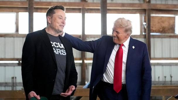 FILE - Tesla and SpaceX CEO Elon Musk, left, and Republican presidential nominee former President Donald Trump attend a campaign event at the Butler Farm Show, Oct. 5, 2024, in Butler, Pa. (AP Photo/Alex Brandon, File)