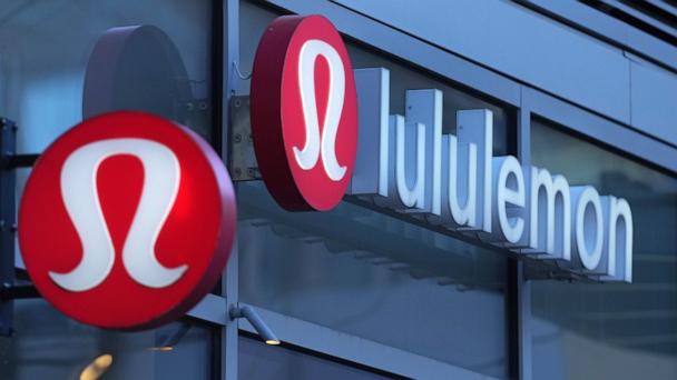 FILE - Lululemon signs are displayed outside a retail location in the Seaport District, Dec. 13, 2024, in Boston. (AP Photo/Charles Krupa, File)