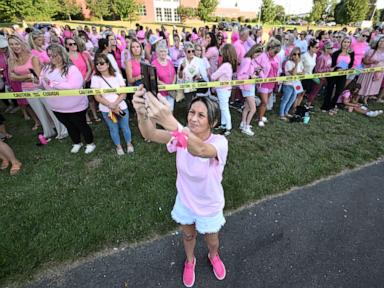 Women in pink rally in support of Lindsay Clancy who is on trial for killing 3 children