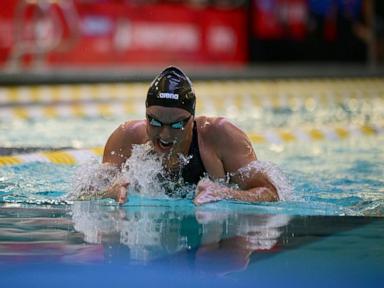 While Simone Biles competes across town, Paralympic star Jessica Long rolls at swimming trials