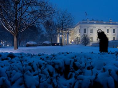 Snow, freezing rain pummel mid-Atlantic while California prepares for likely flooding