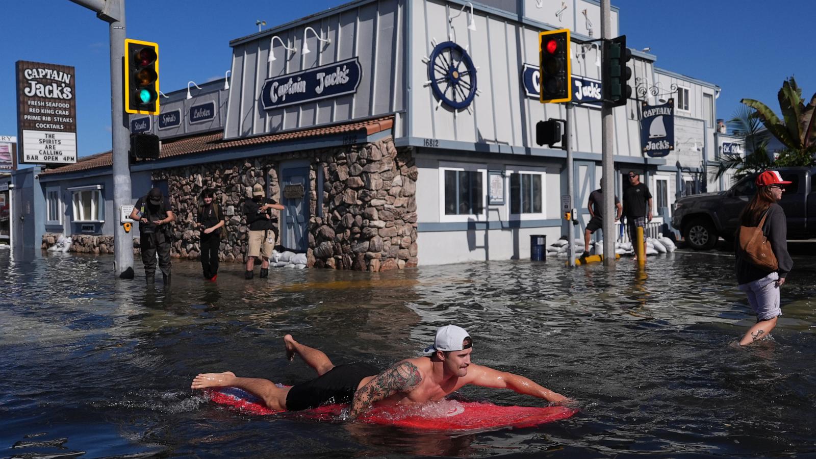 King tides inundate streets and flood homes and businesses along both US coasts