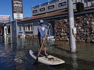 King tides inundate streets and flood homes and businesses along both US coasts
