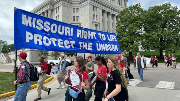Participants in the Midwest March for Life walk past the Missouri Capitol on May 1, 2025, in Jefferson City, Mo. (AP Photo/David A. Lieb)