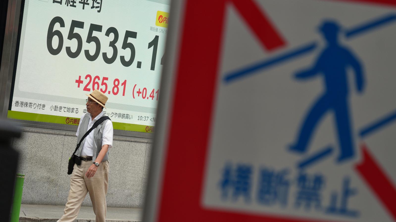 Asian shares are mixed as Brent crude approaches $100 a barrel
