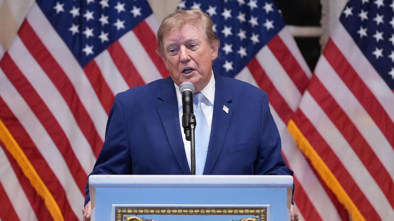 Trump puts new Russia sanctions passed by Congress on hold, saying waiver is in US national interest