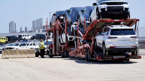 File - A truck loaded with new cars arrives arrives at the Stellantis Belvidere Assembly Plant on Monday, July 10, 2023, in Belvidere. Ill. (AP Photo/Charles Rex Arbogast, File)