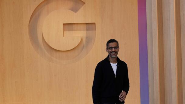 Alphabet CEO Sundar Pichai smiles as he walks onto the stage at a Google I/O event in Mountain View, Calif., Tuesday, May 20, 2025. (AP Photo/Jeff Chiu)