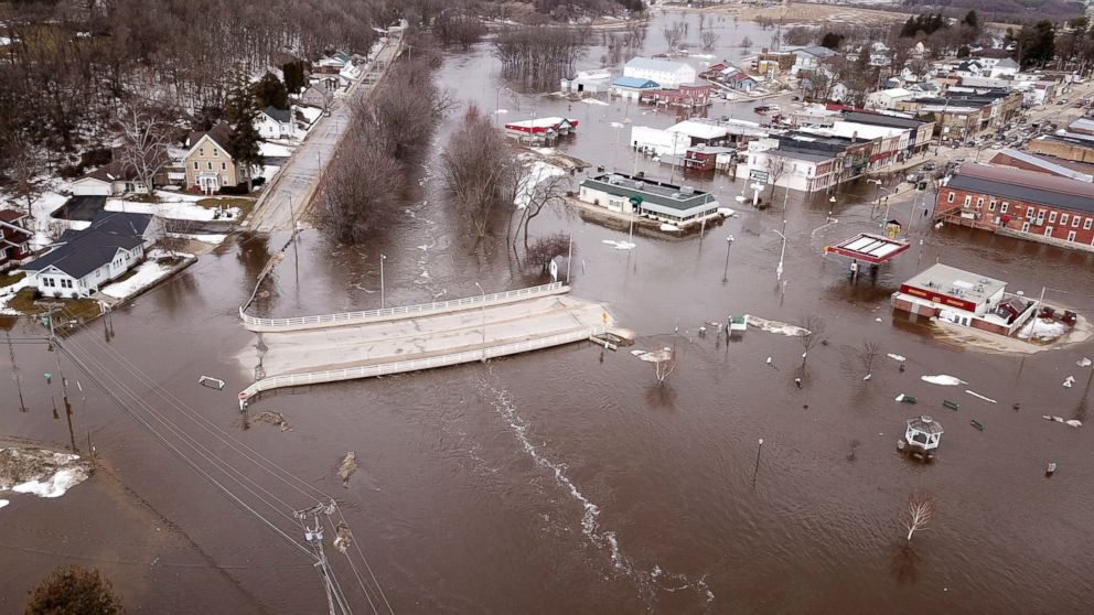 PHOTO: The swollen Pecatonica River spills into downtown Darlington, Wis., on Thursday March 14, 2019. The National Weather Service has issued a flood warning or flood watch for about two-thirds of the state.