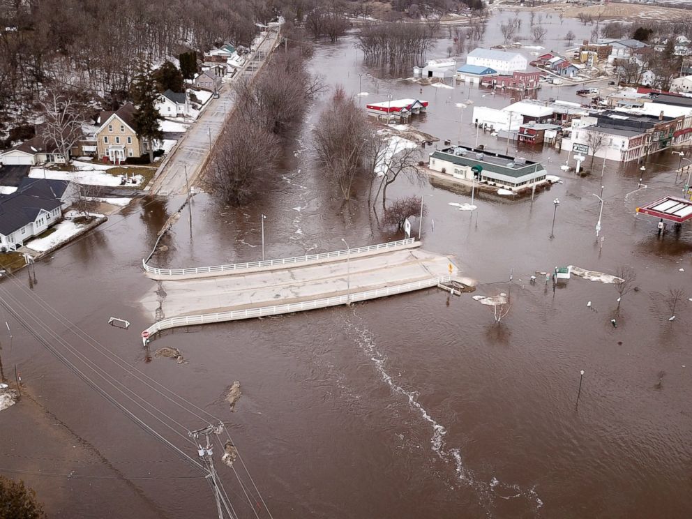PHOTO: The swollen Pecatonica River spills into downtown Darlington, Wis., on Thursday March 14, 2019. The National Weather Service has issued a flood warning or flood watch for about two-thirds of the state.