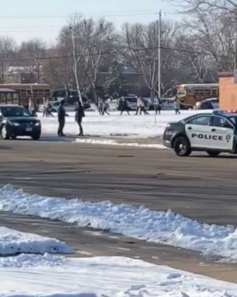 PHOTO: Students exit Oshkosh West High School in Wisconsin after an officer-involved shooting, Dec. 3, 2019.