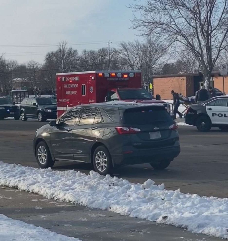 PHOTO: A person is carried out of Oshkosh West High School in Wisconsin on a stretcher after an officer-involved shooting, Dec. 3, 2019.