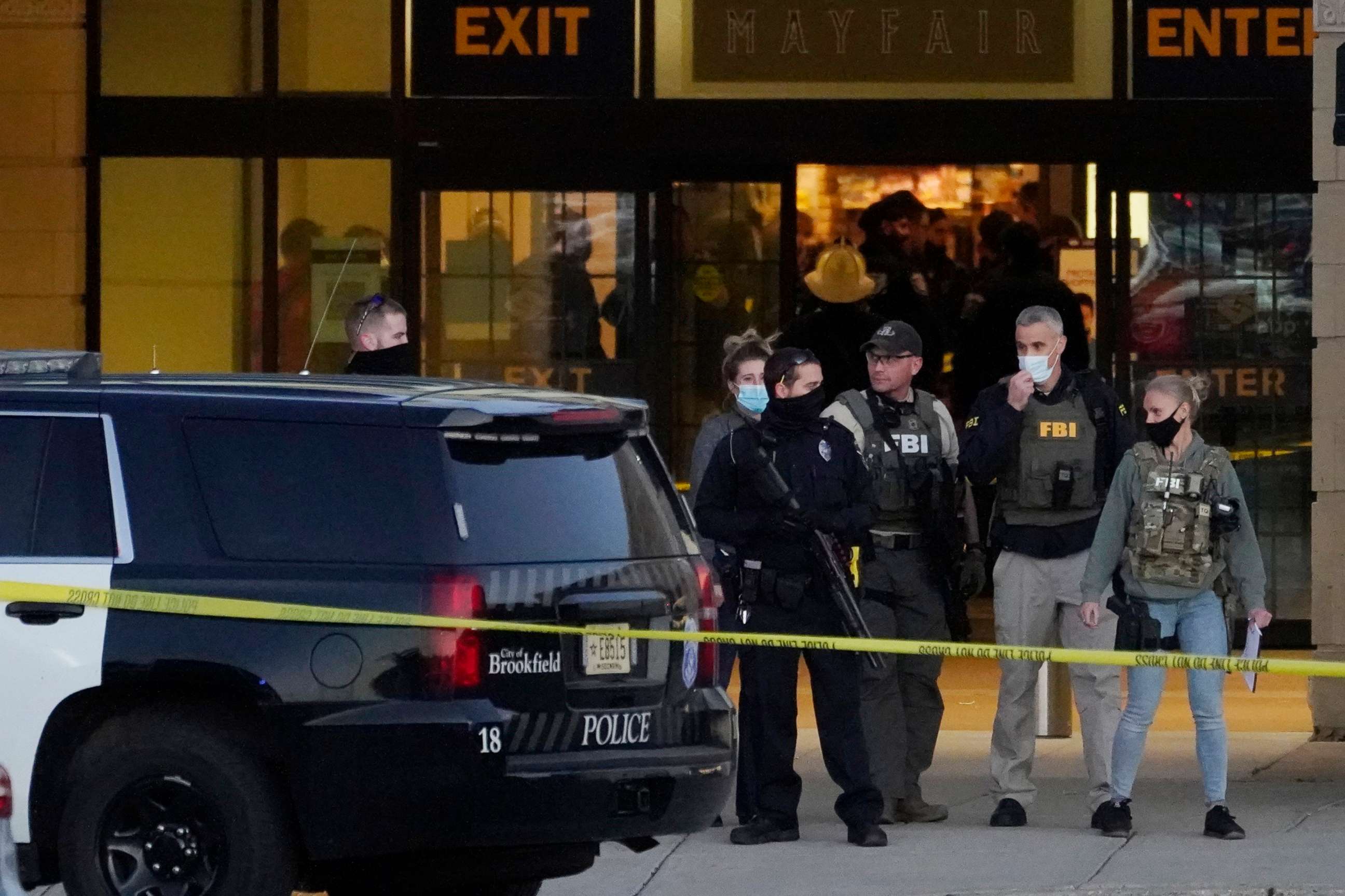 PHOTO: FBI officials and police stand outside the Mayfair Mall after a shooting, Friday, Nov. 20, 2020, in Wauwatosa, Wis.