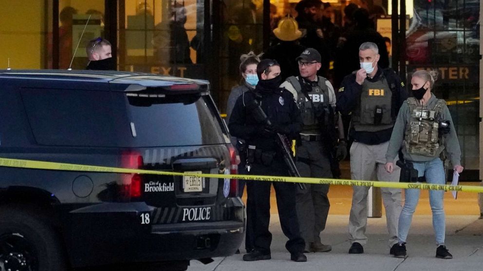 PHOTO: FBI officials and police stand outside the Mayfair Mall after a shooting, Friday, Nov. 20, 2020, in Wauwatosa, Wis.