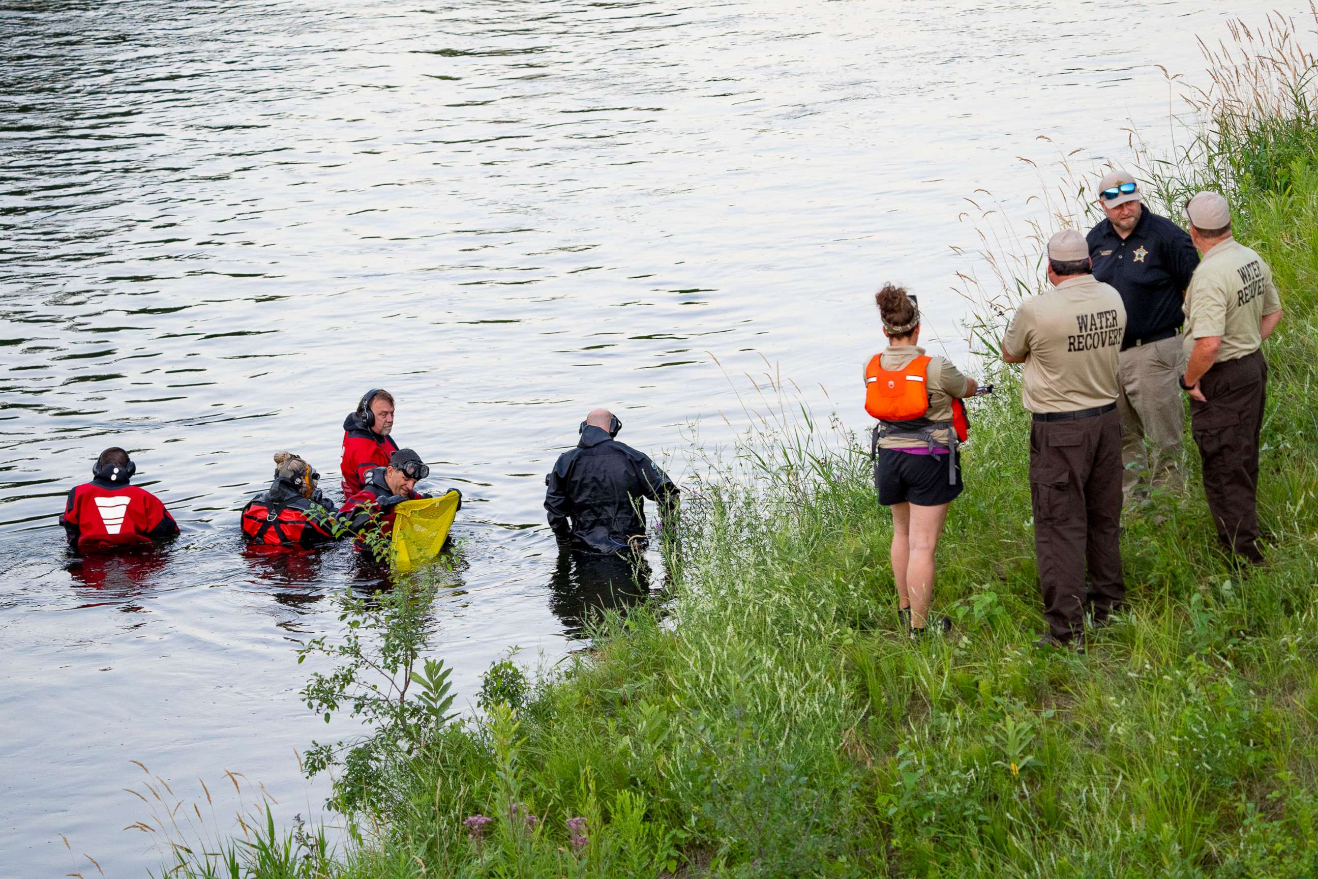 PHOTO: Water Recovery authorities comb the Apple River with metal detectors after five people were stabbed while tubing down the river in Somerset, Wis., July 30, 2022.