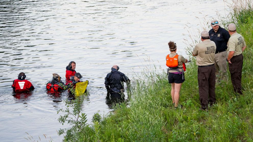 PHOTO: Water Recovery authorities comb the Apple River with metal detectors after five people were stabbed while tubing down the river in Somerset, Wis., July 30, 2022.