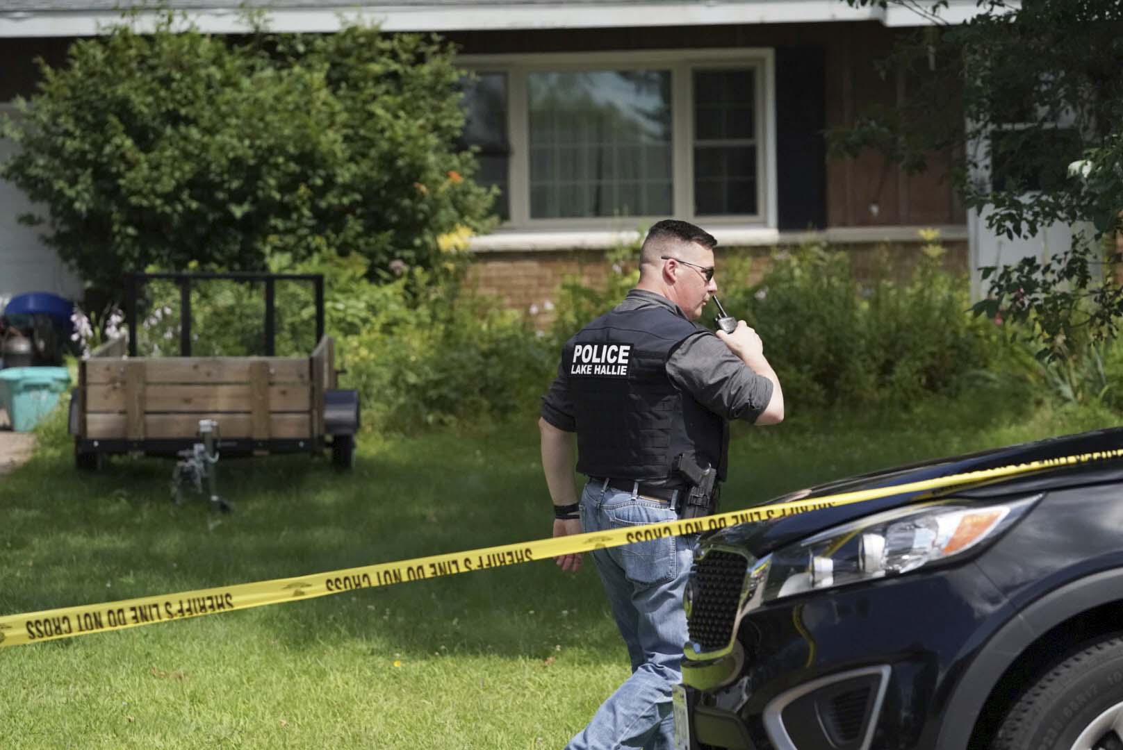 PHOTO: A Lake Hallie Police officer works outside a home, July 29, 2019, in Lake Hallie, Wis., following a shooting the night before.