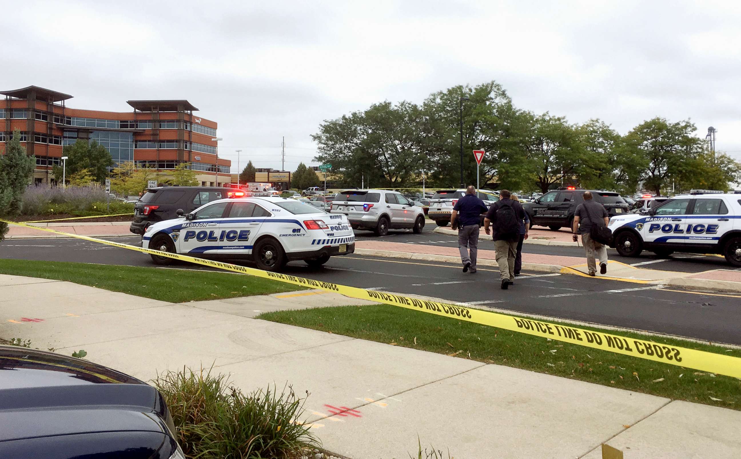 PHOTO: Emergency personnel arrive at the scene where a shooting was reported at a software company in Middleton, Wis., a suburb of Madison, Sept. 19, 2018.