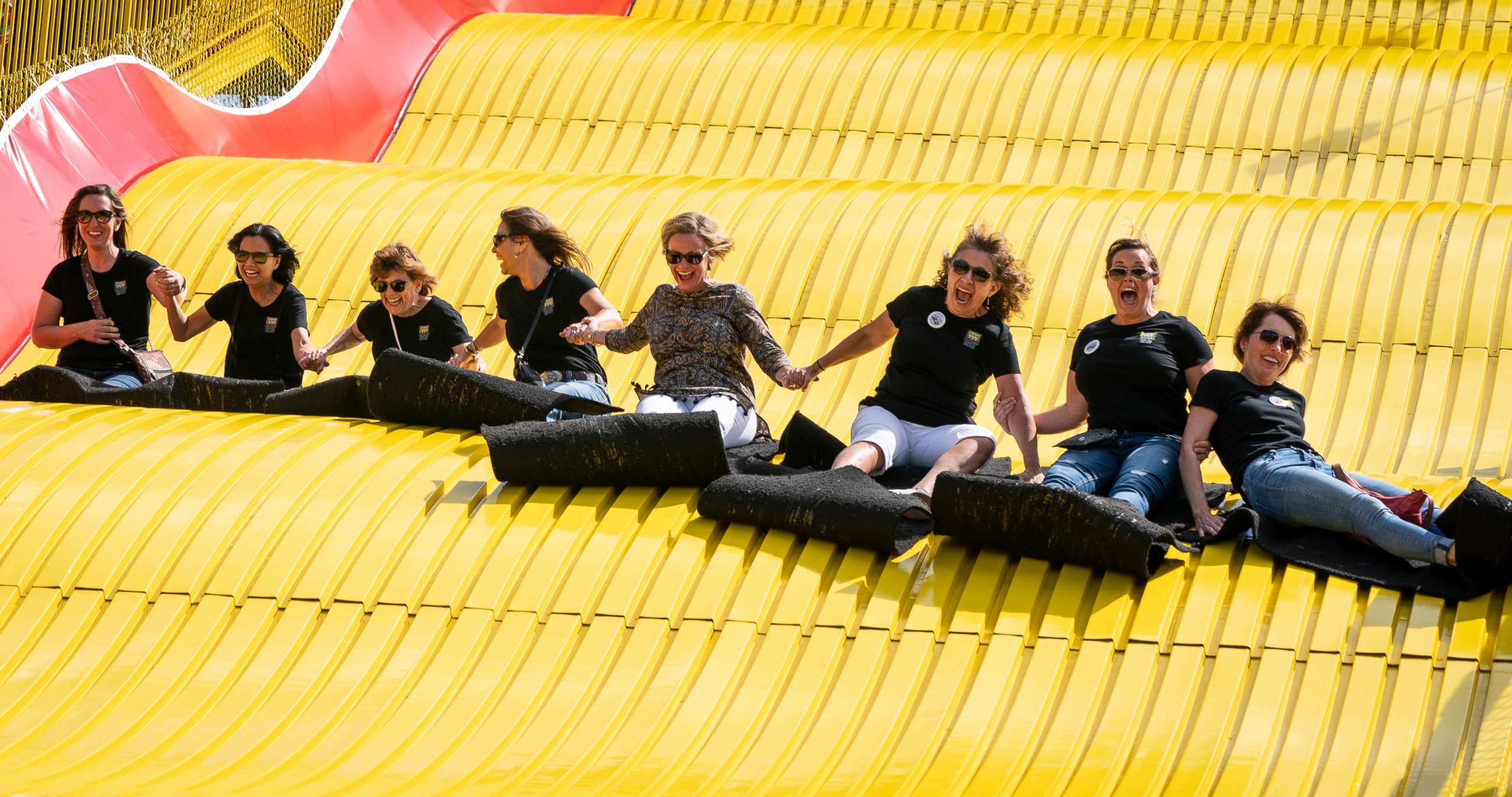 PHOTO: A group of ladies ride the Giant Slide together during the first day of the Minnesota State Fair in Falcon Heights, Minn., Aug. 22, 2019.
