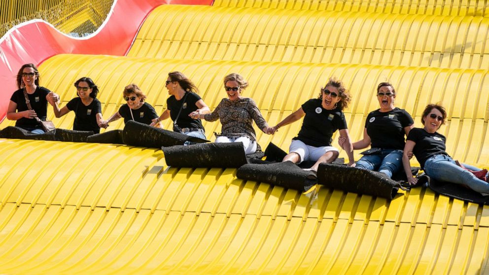 PHOTO: A group of ladies ride the Giant Slide together during the first day of the Minnesota State Fair in Falcon Heights, Minn., Aug. 22, 2019.