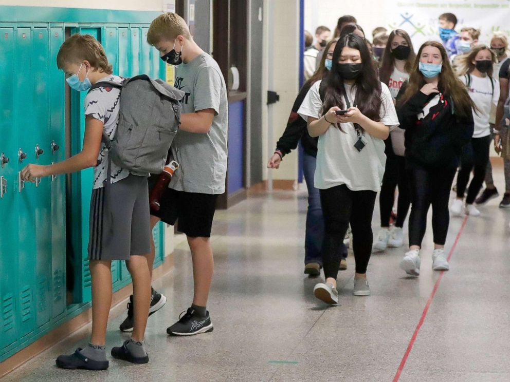 PHOTO: Students make their way to their lockers and classrooms on the first day of school at Benjamin Franklin Middle School in Stevens Point, Wis., Sept. 2, 2021.
