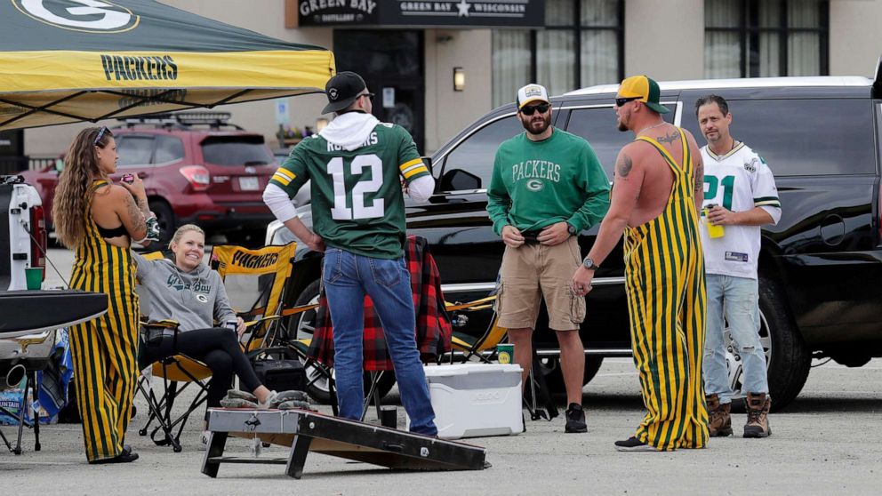 PHOTO: A small group of fans tailgate at the Green Bay Distillary prior to the Green Bay Packers play against Detroit Lions, Sept. 20, 2020, at Lambeau Field in Green Bay, Wis.