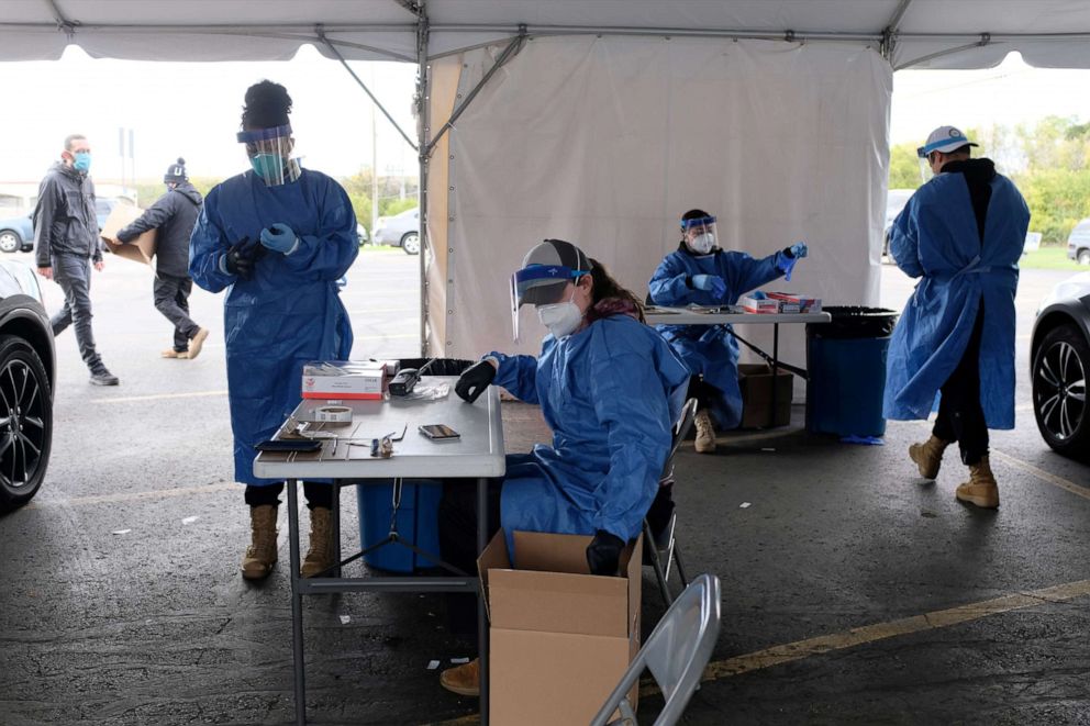 PHOTO: Personnel administer COVID-19 tests in Milwaukee as cases spread in the Midwest, Oct. 2, 2020.