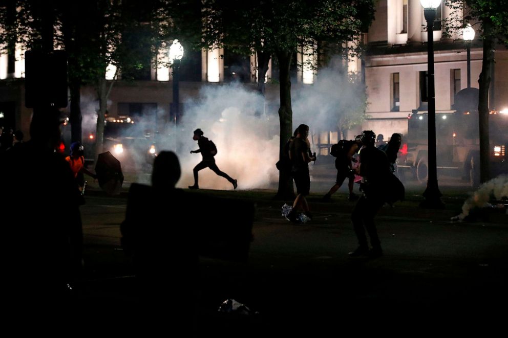 PHOTO: Protesters clash with Kenosha County Sherriff's officers in front of the County Court House during demonstrations  in Kenosha, Wisc., on Aug. 24, 2020.