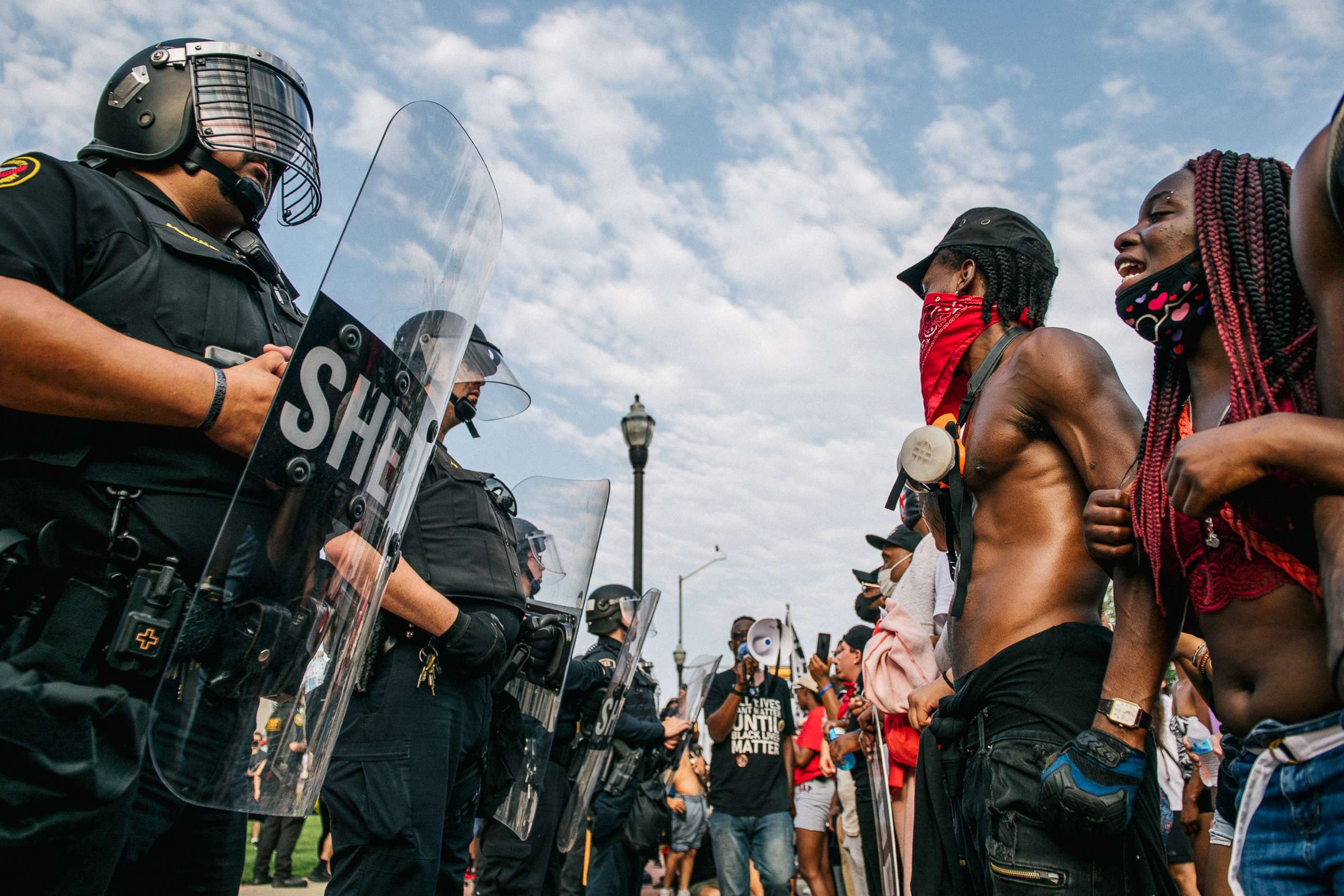 PHOTO: Demonstrators participate in a form a line in front of law enforcement on Aug. 24, 2020 in Kenosha, Wisc.