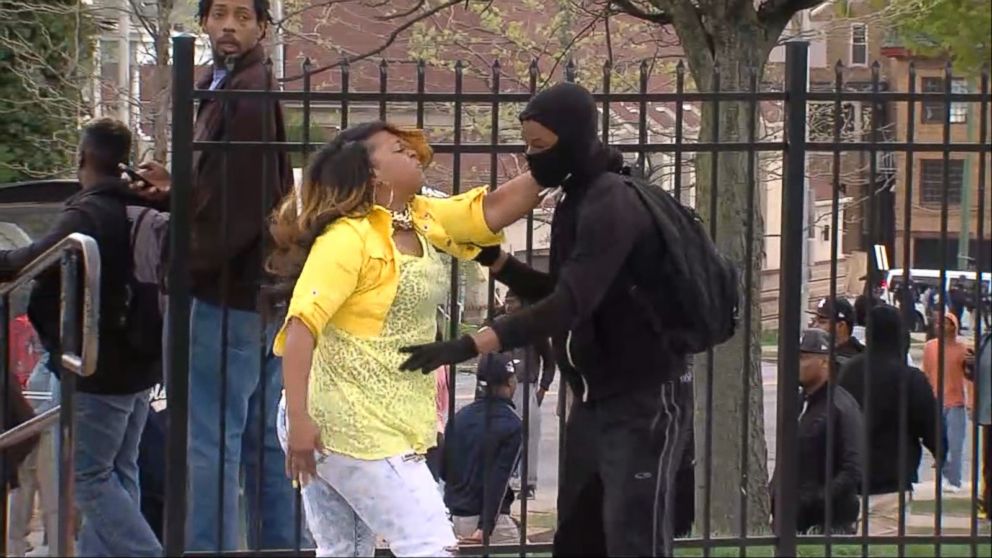 PHOTO: A woman smacks a boy that has been reported to be her son after seeing his involvement in the violent demonstrations in Baltimore, April 27, 2015. 