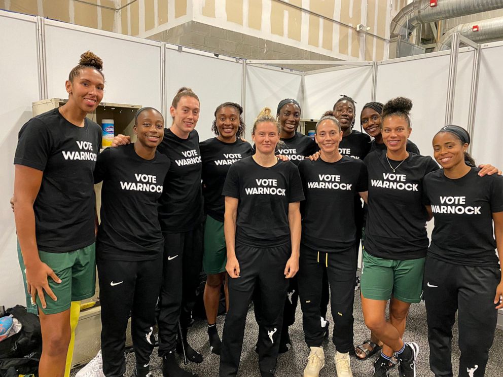 PHOTO: WNBA players wear a "Vote Warnock" t-shirt in a photo Sue Bird posted to her Twitter account, Aug. 4, 2020.