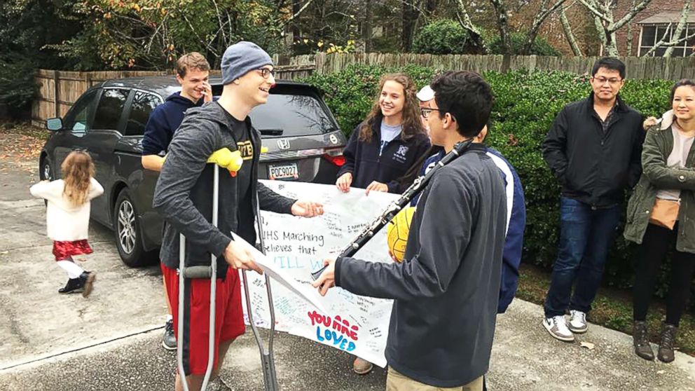 PHOTO: Josh Libman, in the hat, thanks members of the Norcross High School marching band for coming to his house Thursday to "ring the bell" as he nears an end to chemotherapy treatment.