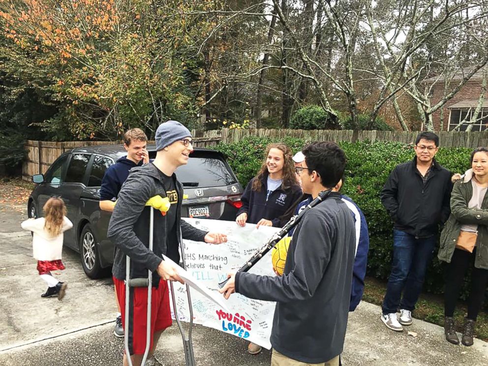 PHOTO: Josh Libman, in the hat, thanks members of the Norcross High School marching band for coming to his house Thursday to "ring the bell" as he nears an end to chemotherapy treatment.