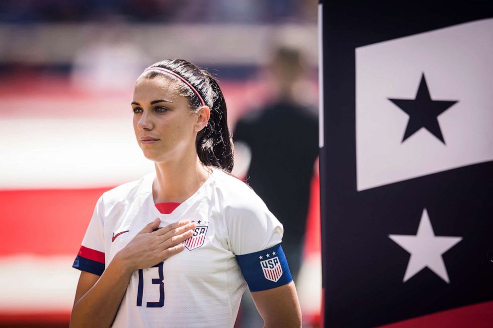 PHOTO: Captain Alex Morgan of United States holds her hand to her heart at the start of the International Friendly match the U.S. Women's National Team and Mexico prior to the FIFA Women's World Cup, May 26 2019, in Harrison, N.J.
