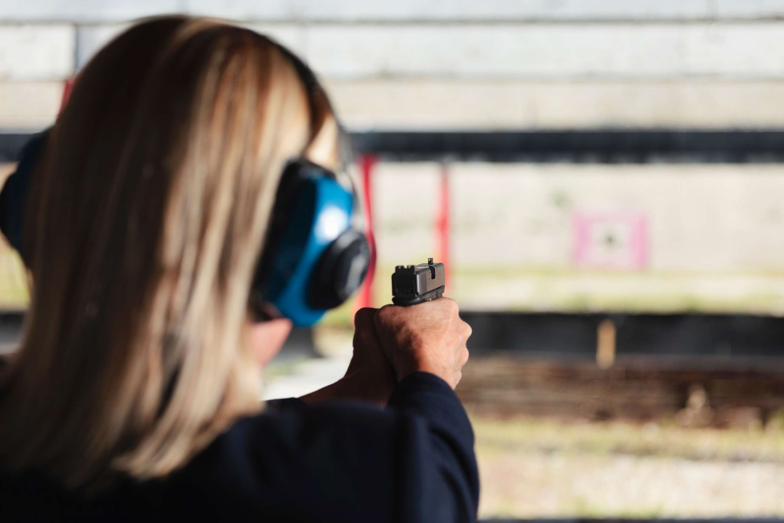 PHOTO: A woman at the shooting range aiming a gun in an undated stock photo. 