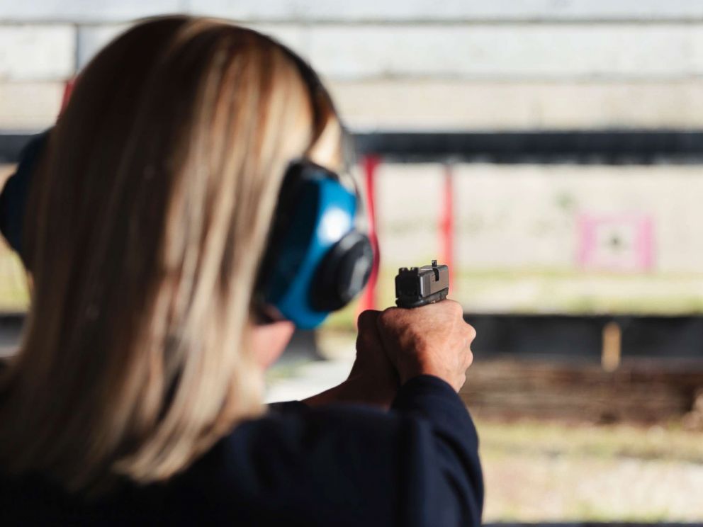 PHOTO: A woman at the shooting range aiming a gun in an undated stock photo.