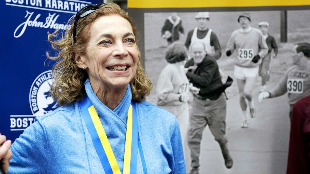 PHOTO: Kathrine Switzer, the first official woman entrant in the Boston Marathon in 1967, smiles while standing in front of an image of herself being harassed while competing in that race during a news conference in Boston, April 18, 2017. 