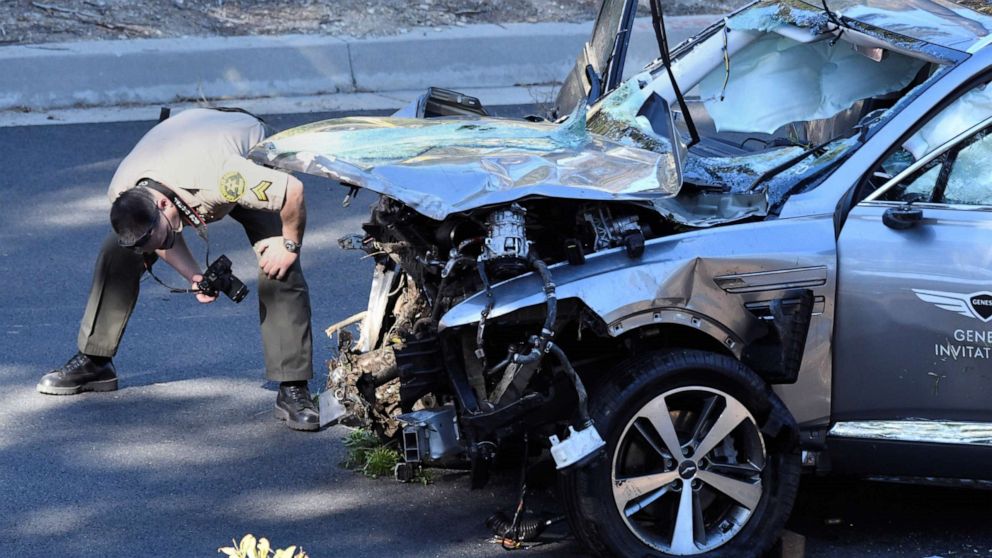 PHOTO: Los Angeles County Sheriff's Deputies inspect the vehicle of golfer Tiger Woods after it was involved in a single-vehicle accident in Los Angeles, Feb. 23, 2021.