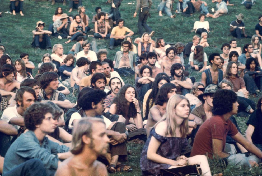 PHOTO: Audience members watch a performance at the Woodstock Music and Arts Fair in Bethel, New York, August 1969.