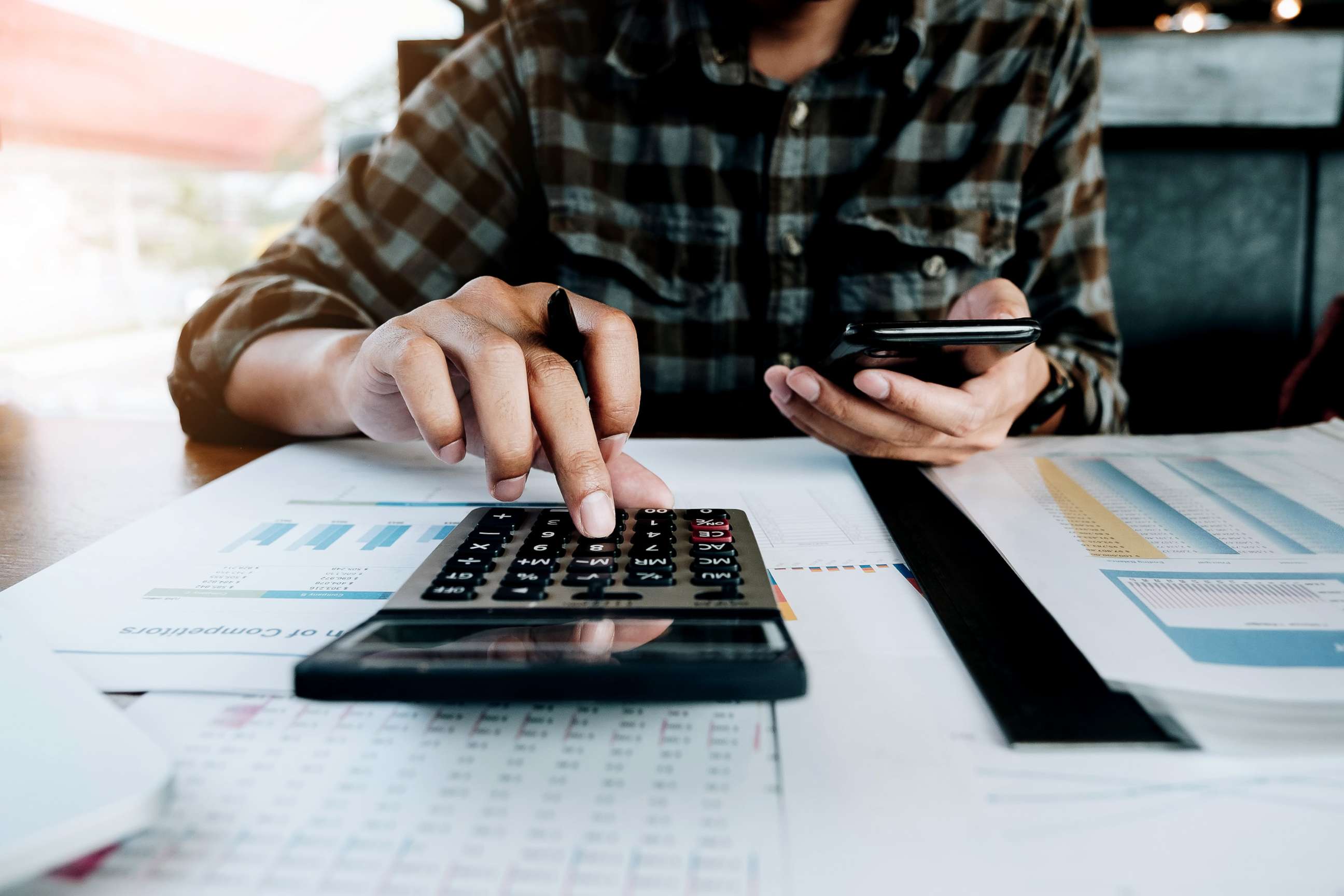 PHOTO: A calculator is used while filing paperwork in an undated stock image.