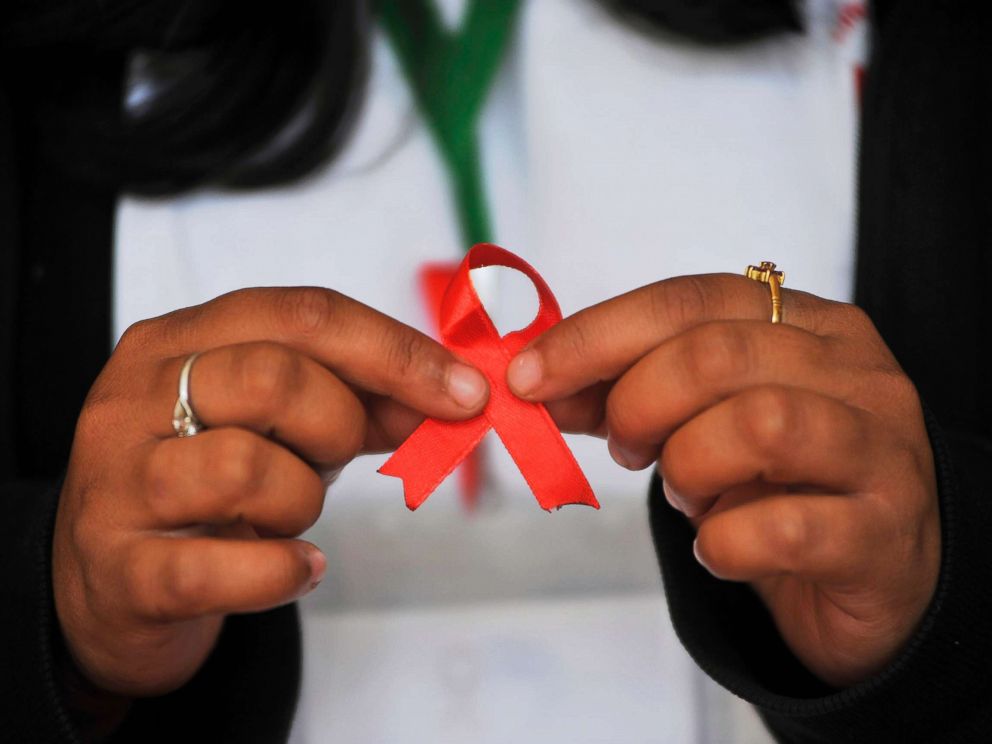PHOTO: A Nepalese youth shows AIDS symbol Red Ribbon on celebrates of 29th World AIDS Day in Kathmandu, Nepal, Dec. 1, 2016.