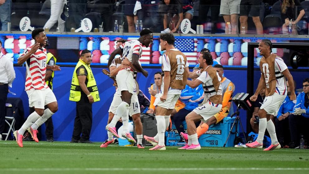 PHOTO: Folarin Balogun of USA (C) celebrates with his teammates after scoring a goal during the FIFA World Cup 2026 group stage match against Paraguay, in Los Angeles, California, June 12, 2026.