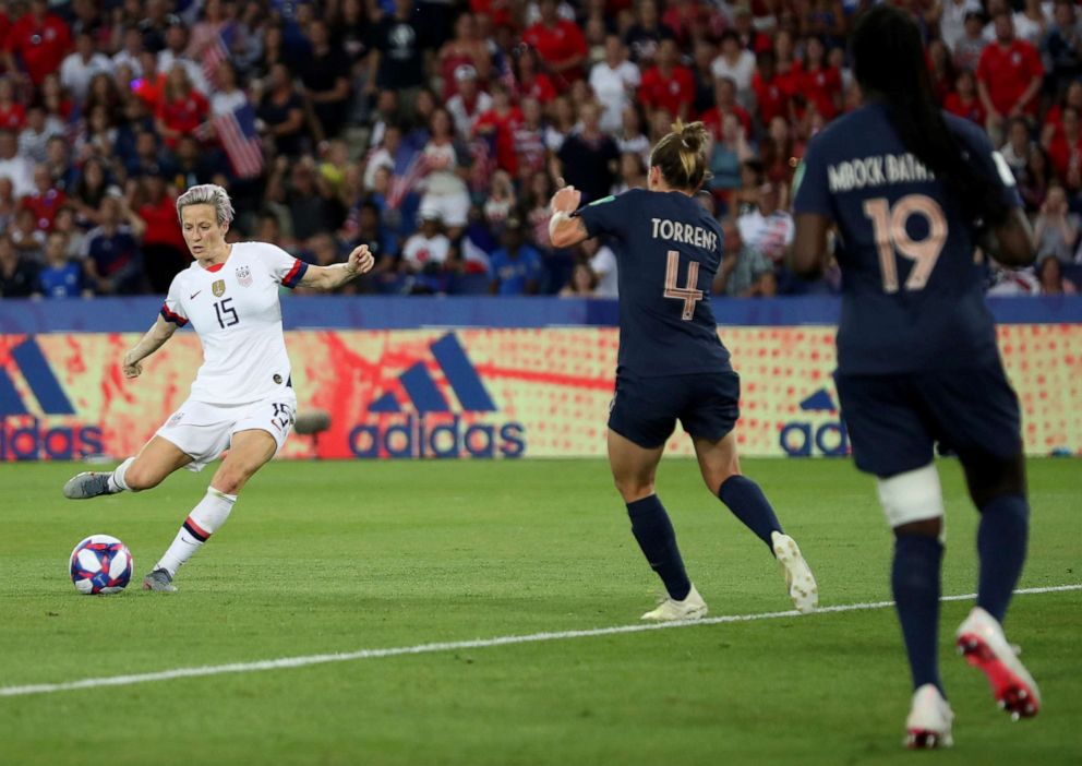 PHOTO: United States' Megan Rapinoe, right, on her way to scoring her side's second goal during the Women's World Cup quarterfinal soccer match between France and the United States at the Parc des Princes, in Paris, June 28, 2019.