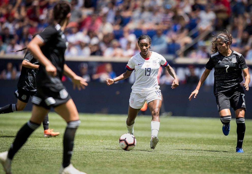 PHOTO: Crystal Dunn of United States looks for the opening against Mexico team defenders during the International Friendly match as part of the Send Off Series prior to the FIFA Women's World Cup, May 26 2019, in Harrison, N.J.